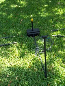 The fishing poles screw into the sides of the box.